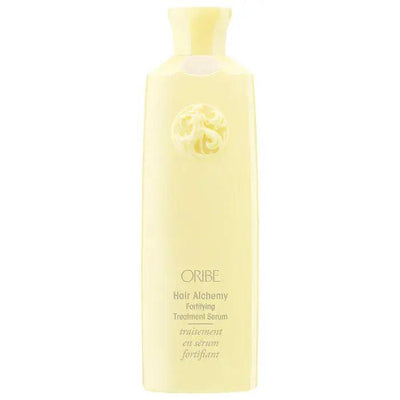 ORIBE Hair Alchemy Fortifying Treatment Serum in a sleek yellow bottle, designed to strengthen and protect hair.