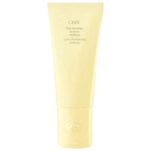 Oribe Hair Alchemy Resilience Conditioner in yellow tube for strength, softness, and moisture for hair care.