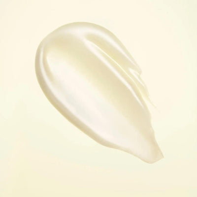 smooth and creamy texture of Hair Alchemy Resilience Conditioner against a soft background