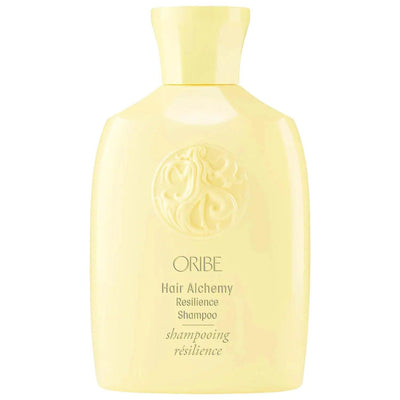 Oribe Hair Alchemy Resilience Shampoo bottle in yellow, designed to strengthen and nourish weak hair.