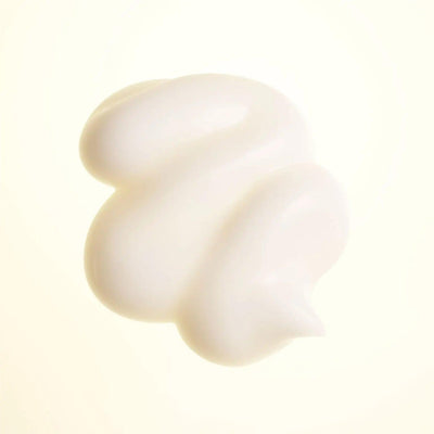 Creamy texture of Hair Alchemy Strengthening Masque for intense hydration and hair strengthening.