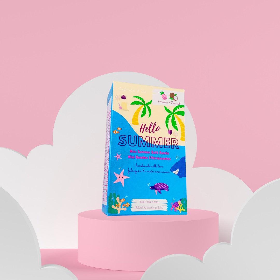 Hello Summer mini bath bombs packaging on a pink background, featuring tropical design and vibrant colors.