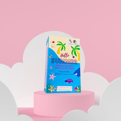 Hello Summer mini bath bombs packaging on a pink background, featuring tropical design and vibrant colors.