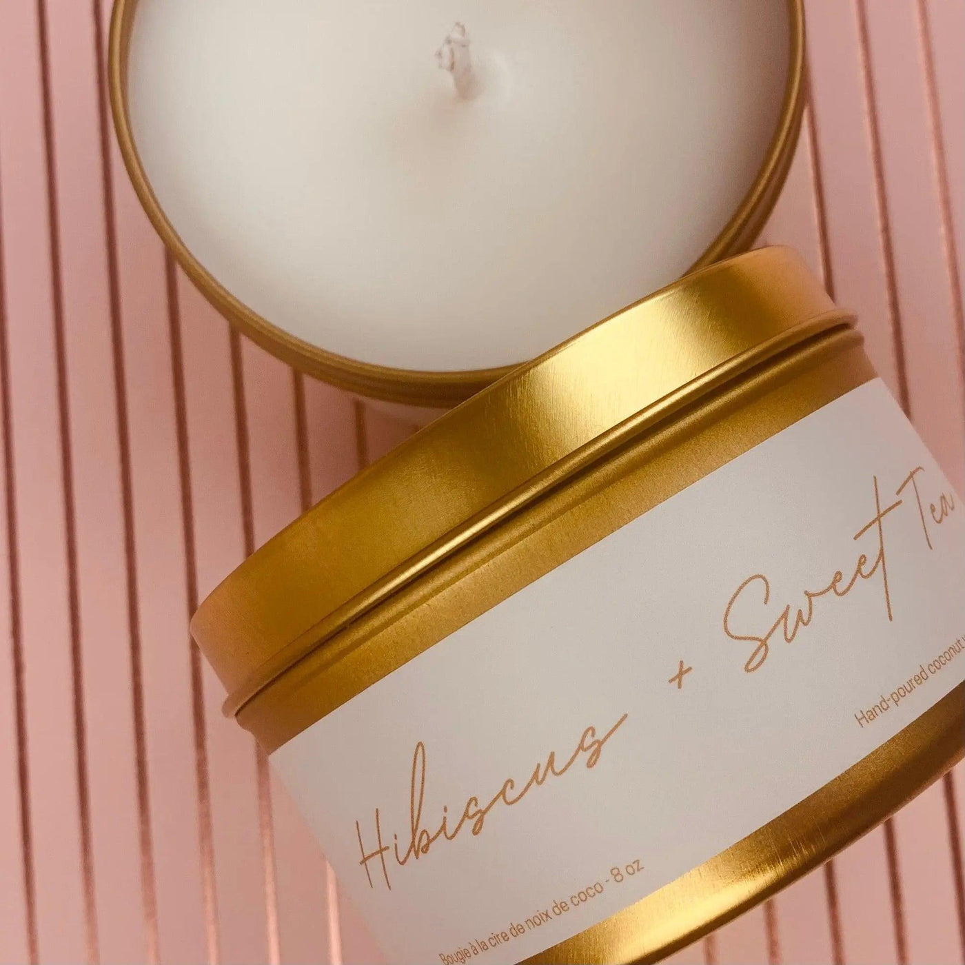 Hibiscus & Sweet Tea candle in gold metal tin, featuring coconut wax blend and premium fragrances.