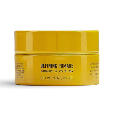 Lock Stock & Barrel Defining Pomade in a yellow jar, 85g, offers high shine and steadfast hold for sleek hairstyles.