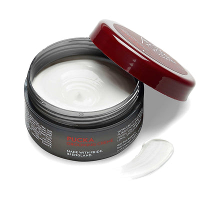 Pucka Grooming Creme 3.53 oz in open jar, showcasing its creamy texture and natural finish for medium hold.