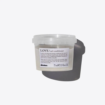 Davines LOVE curl conditioner for curly hair, 75 ml. This nourishing conditioner enhances curls and controls frizz for soft, defined locks.