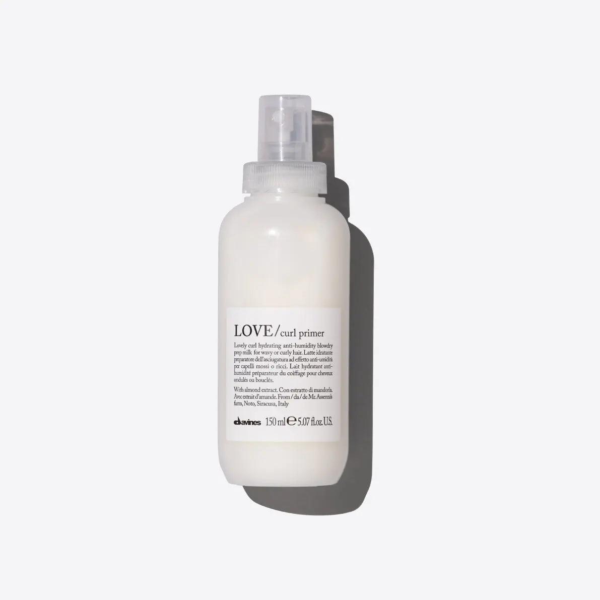 LOVE curl primer spray for hair, 150ml bottle on white background.