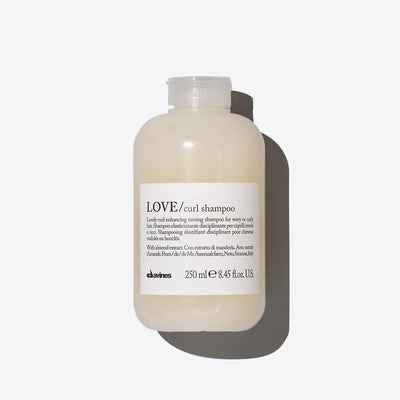 250ml bottle of Davines LOVE curl shampoo for wavy curly hair, nourishing and enhancing with almond extract.