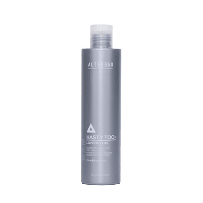 Hasty Too Love Me Curl modeling fluid for natural curl control and soft, defined curls in a sleek gray bottle.