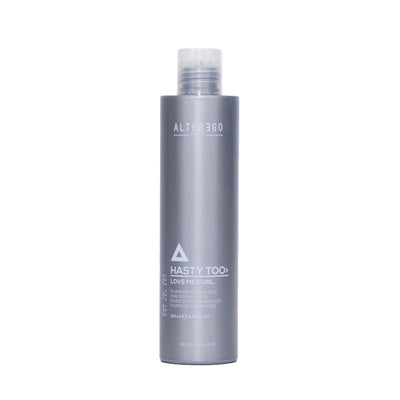 Hasty Too Love Me Curl modeling fluid for soft curl definition and long-lasting hold in a sleek silver bottle.