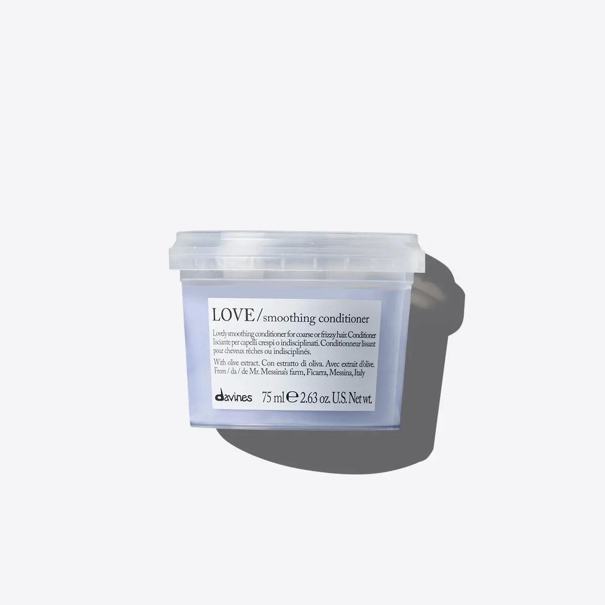 Davines Love Smoothing Conditioner in a clear container, designed to nourish and tame frizzy hair.