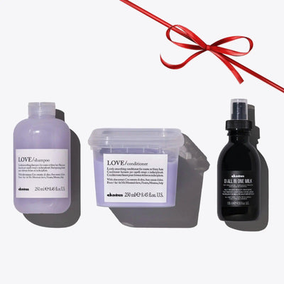 Davines Love Smoothing + Oi Set with shampoo, conditioner, and Oi All In One Milk for nourished, shiny hair.