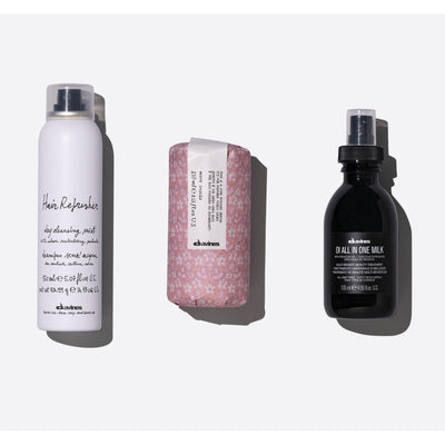 Low-maintenance textured hair set featuring Hair Refresher, Curl Building Serum, and OI All In One Milk for quick styling.