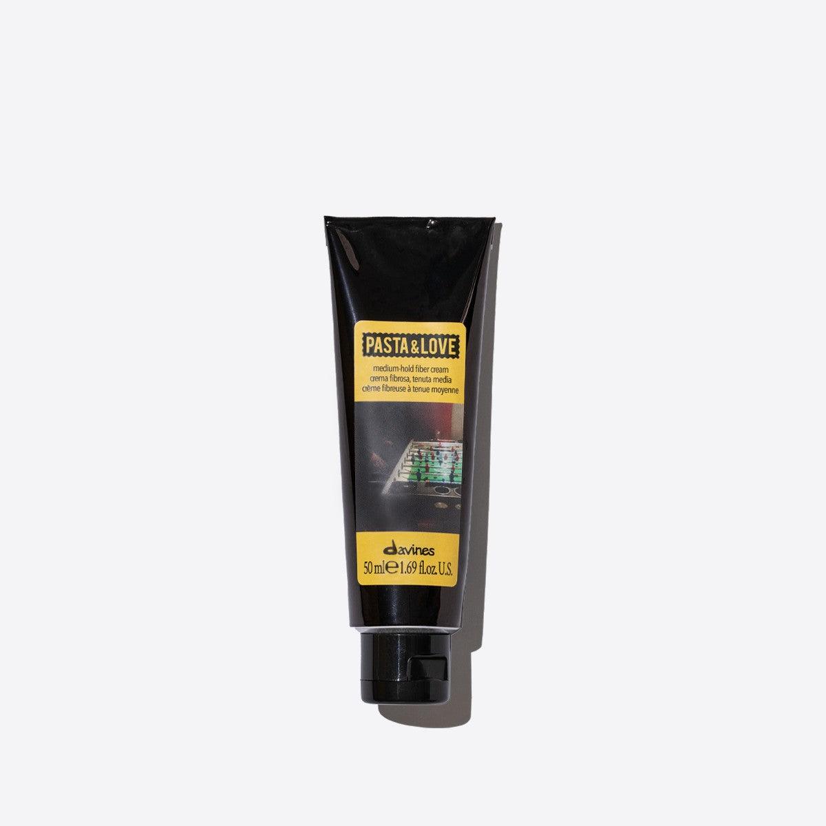 Medium hold fiber cream in a sleek black tube, designed for flexible styling and natural finish for all hair types.