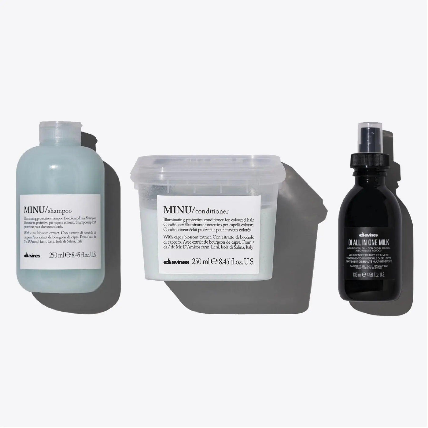 Davines MINU + OI Set featuring shampoo, conditioner, and all-in-one milk for vibrant color and shine.