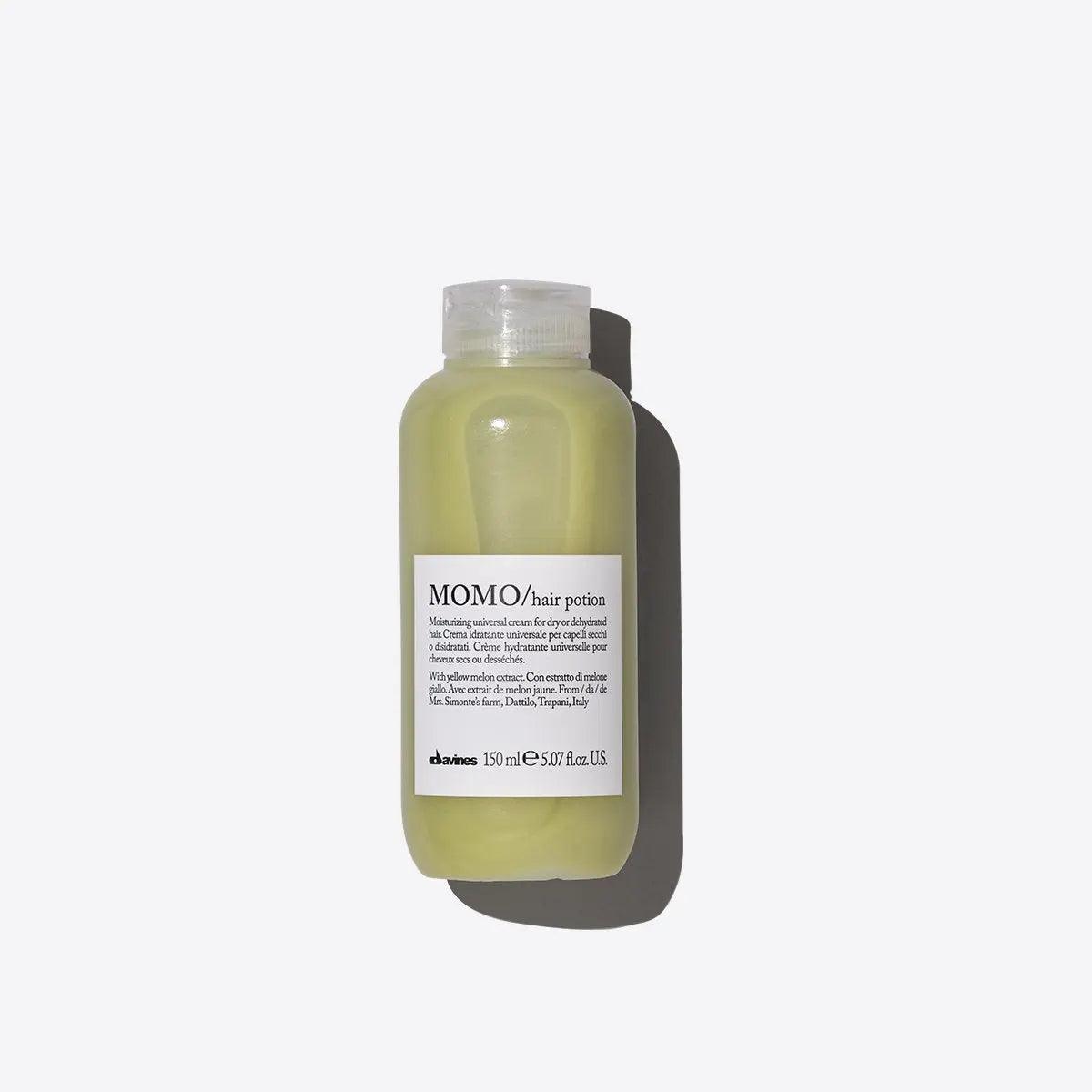Momo Hair Potion bottle for moisturizing dry hair, featuring a lightweight silky texture for hydration and shine.