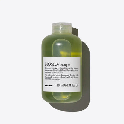 Davines MOMO moisturizing shampoo bottle for dry, dehydrated hair, 250 ml, 8.45 fl oz, with hydrating and cleansing properties, green and clear packaging