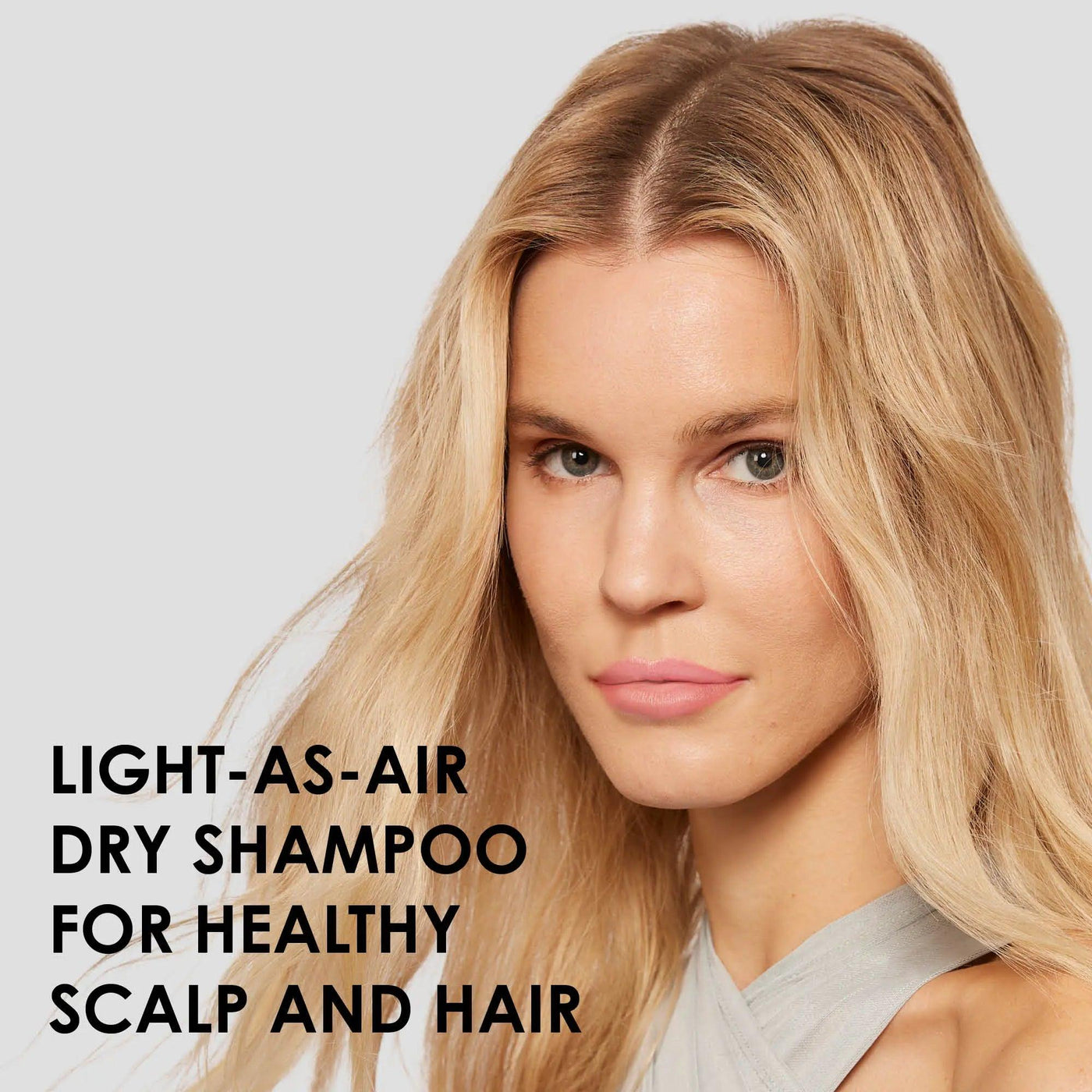 Model showcasing Nº.4D Clean Volume Detox Dry Shampoo for a healthy scalp and voluminous hair.