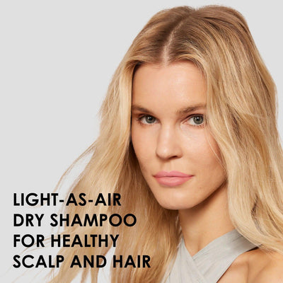 Model showcasing Nº.4D Clean Volume Detox Dry Shampoo for a healthy scalp and voluminous hair.