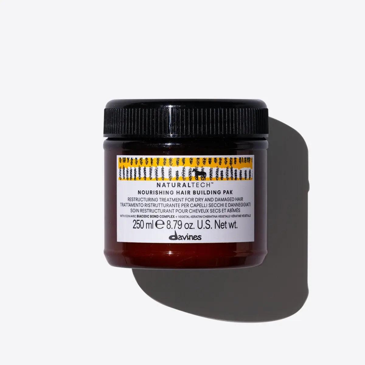 Naturaltech Nourishing Hair Building Pak jar for soft, shiny, and full-bodied hair treatment. Restructuring mask for damaged hair.