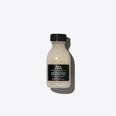High-quality Davines OI Shampoo bottle with a sleek design, nourishing hair care product for smooth, shiny hair.