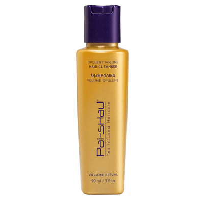 Opulent Volume Hair Cleanser in golden bottle, designed for voluminous, healthy hair with botanical and tea complexes.