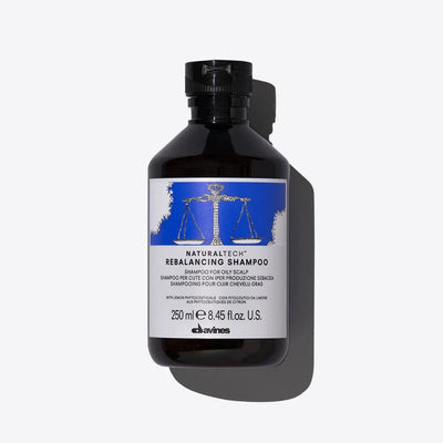 Rebalancing shampoo bottle by Davines for oily scalps, 250 ml, designed to normalize sebum production and cleanse the scalp.