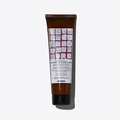Replumping Conditioner by Davines, elasticizing and moisturizing formula for revitalizing hair structure and untangling knots.