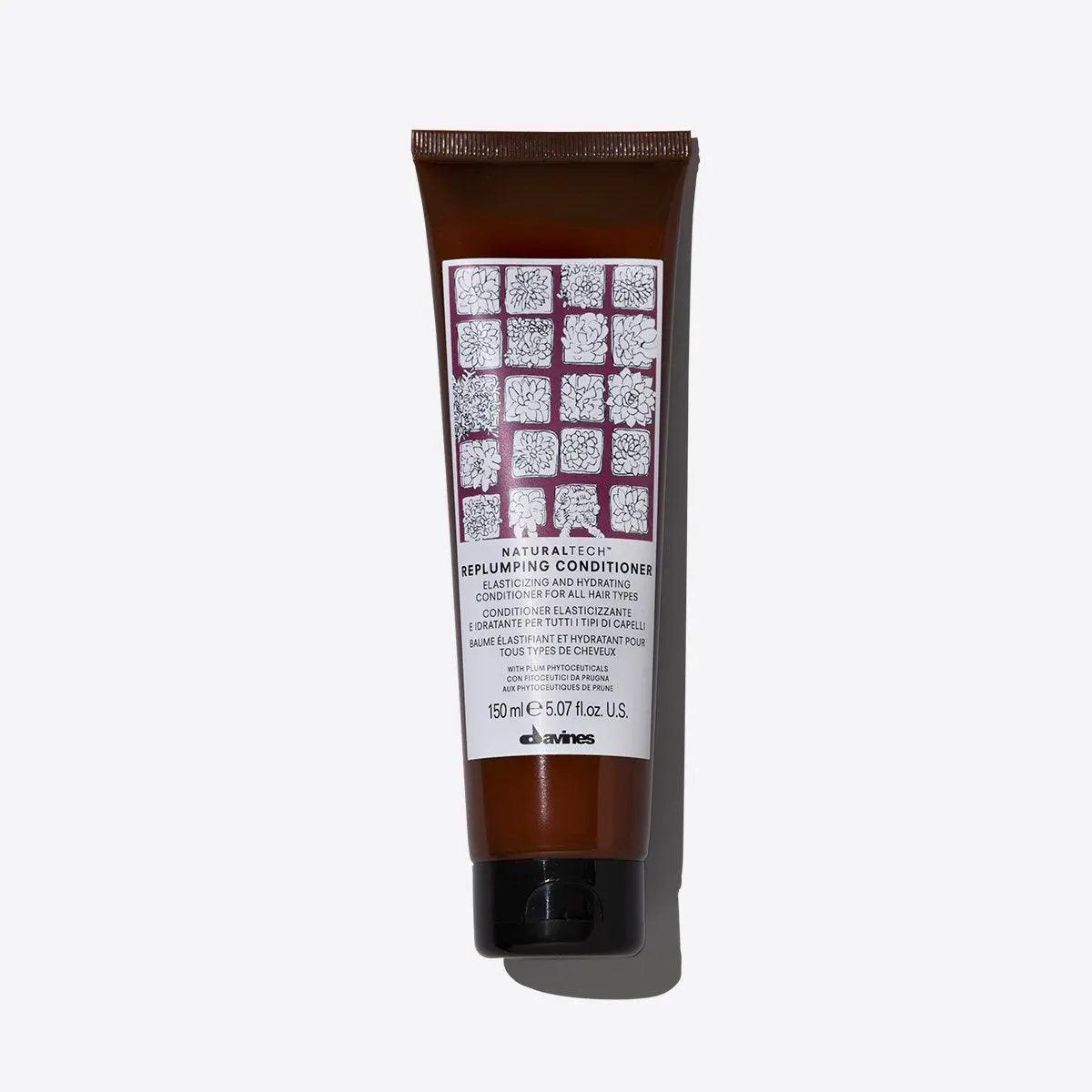 Replumping Conditioner tube by Davines, packed with moisturizing ingredients for elastic and untangled hair.