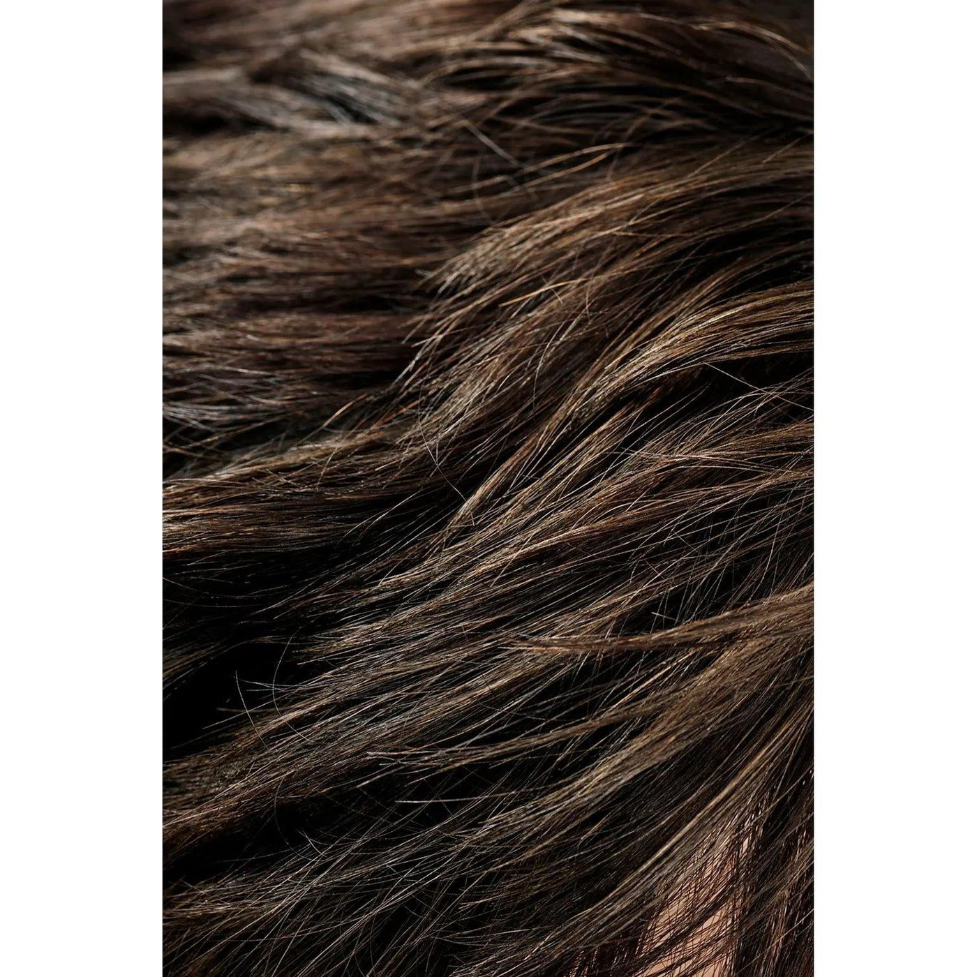 Close-up of dark brown hair with highlights showing texture and shine