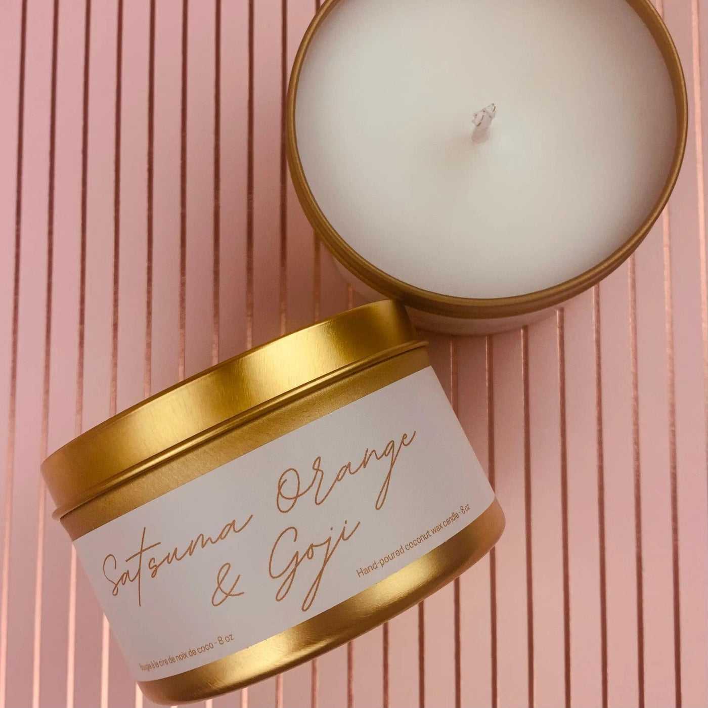 Satsuma, Orange & Goji scented candle in gold tin, showcasing luxury coconut wax blend for home ambiance.