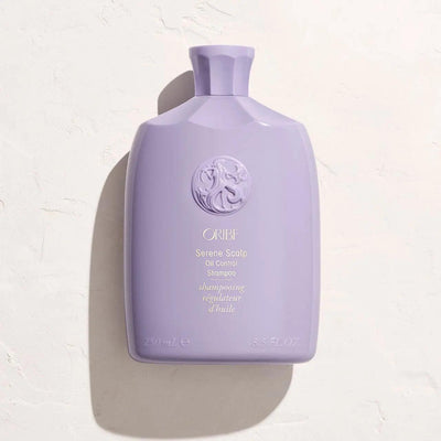 Oribe Serene Scalp Oil Control Shampoo bottle on a light surface, designed for oily scalps and all hair types.