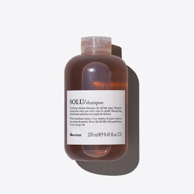 Clarifying Davines SOLU Shampoo bottle for all hair types, 250ml, deep cleansing formula ideal for buildup removal and refreshingly clean hair.