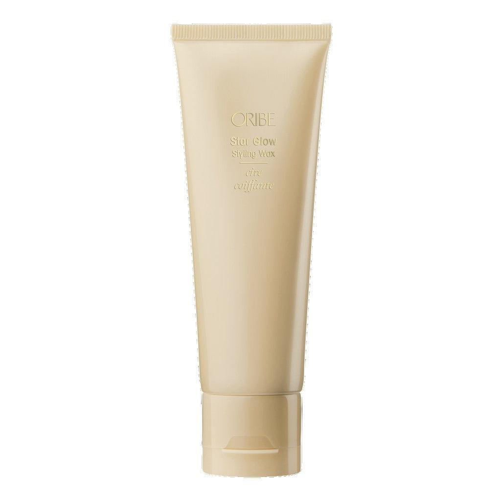 Oribe Star Glow Styling Wax tube for hair shine and styling in beige packaging