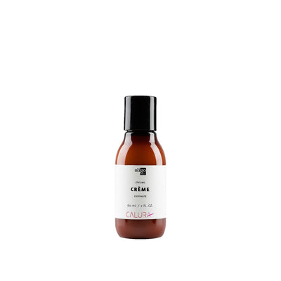 2 oz bottle of Calura Styling Crème for flexible hold and shine, suitable for all hair types, vegan and sulfate free.