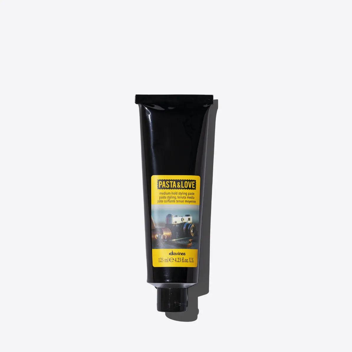 Medium-hold styling paste in a sleek black tube, ideal for flexible styles and natural finish with textured effect.