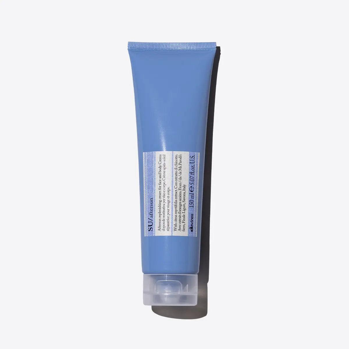 Blue skincare product tube on white background.