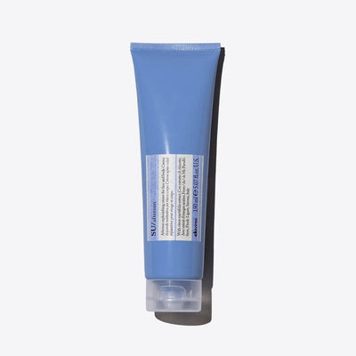 Blue skincare product tube on white background.