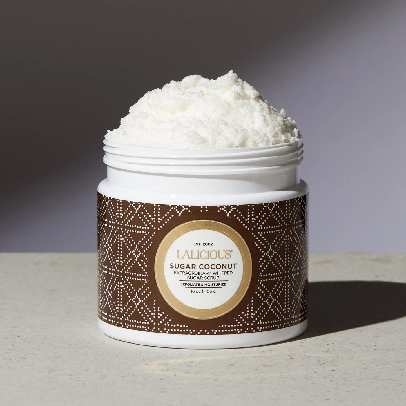 Sugar Coconut Sugar Scrub in a white jar, showcasing premium exfoliating and hydrating formula for radiant skin.