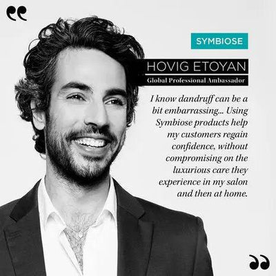 Smiling man promoting Symbiose products, sharing benefits for scalp health and confidence in hair care.
