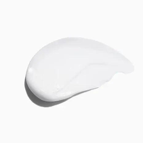 Smooth, creamy texture of Symbiose Fondant Apaisant Essentiel hair conditioner on a white background.