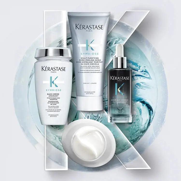 Kérastase Symbiose hair care products including serum, conditioner, and mask on a stylish blue background.
