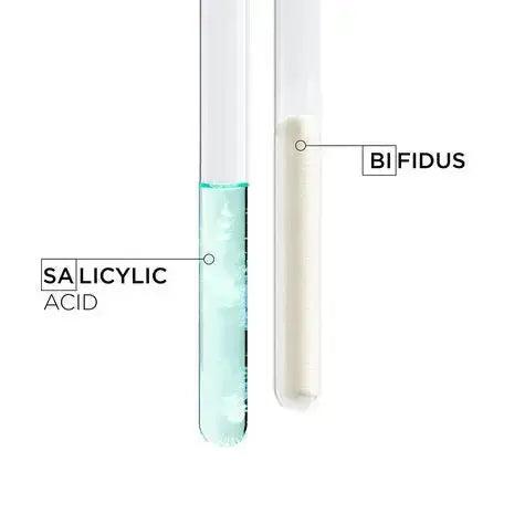 Test tubes labeled Salicylic Acid and Bifidus, showcasing key ingredients for skincare formulations.