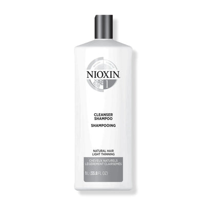 Nioxin Cleanser Shampoo System 1 for fine, thin natural hair in a 1L bottle, detoxifying for healthy growth and volume.