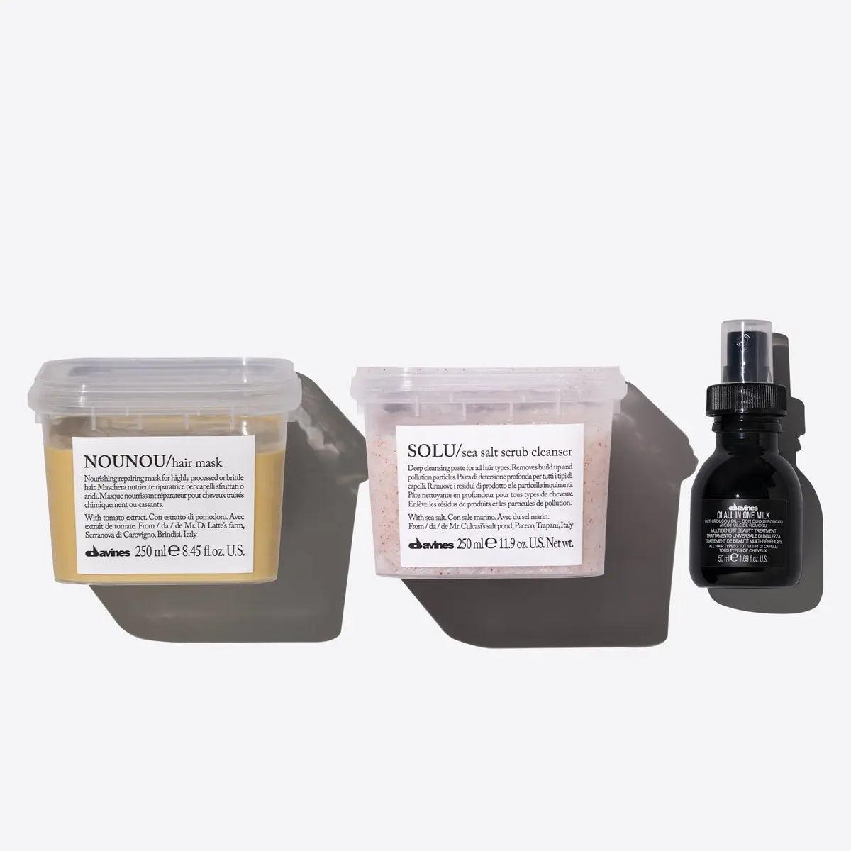 Davines Clean Slate Set featuring NOUNOU hair mask, SOLU sea salt scrub cleanser, and OI All In One Milk in stylish packaging.