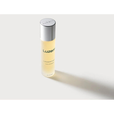 Luzern The Essence weightless skin firming and nourishing hydrating tonic in a sleek bottle on a soft background.