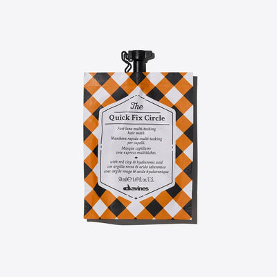 Davines The Quick Fix Circle multi-tasking hair mask pouch with a checkered design, ideal for quick hydration and detangling.