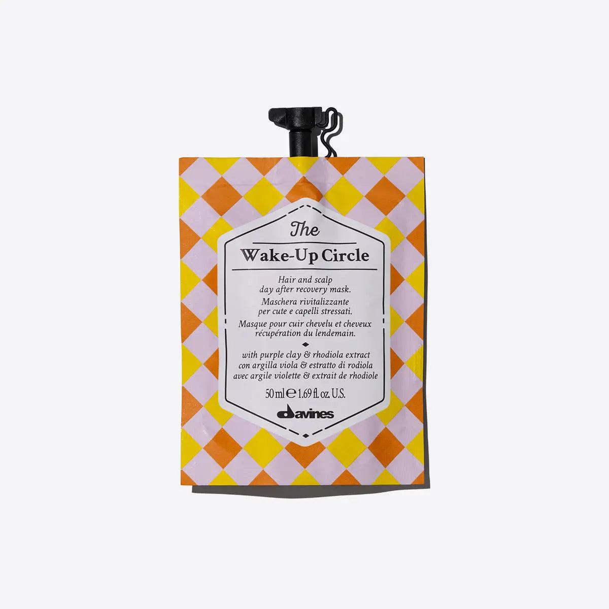 The Wake-Up Circle revitalizing mask packaging for scalp and stressed hair, featuring vibrant yellow and orange design.