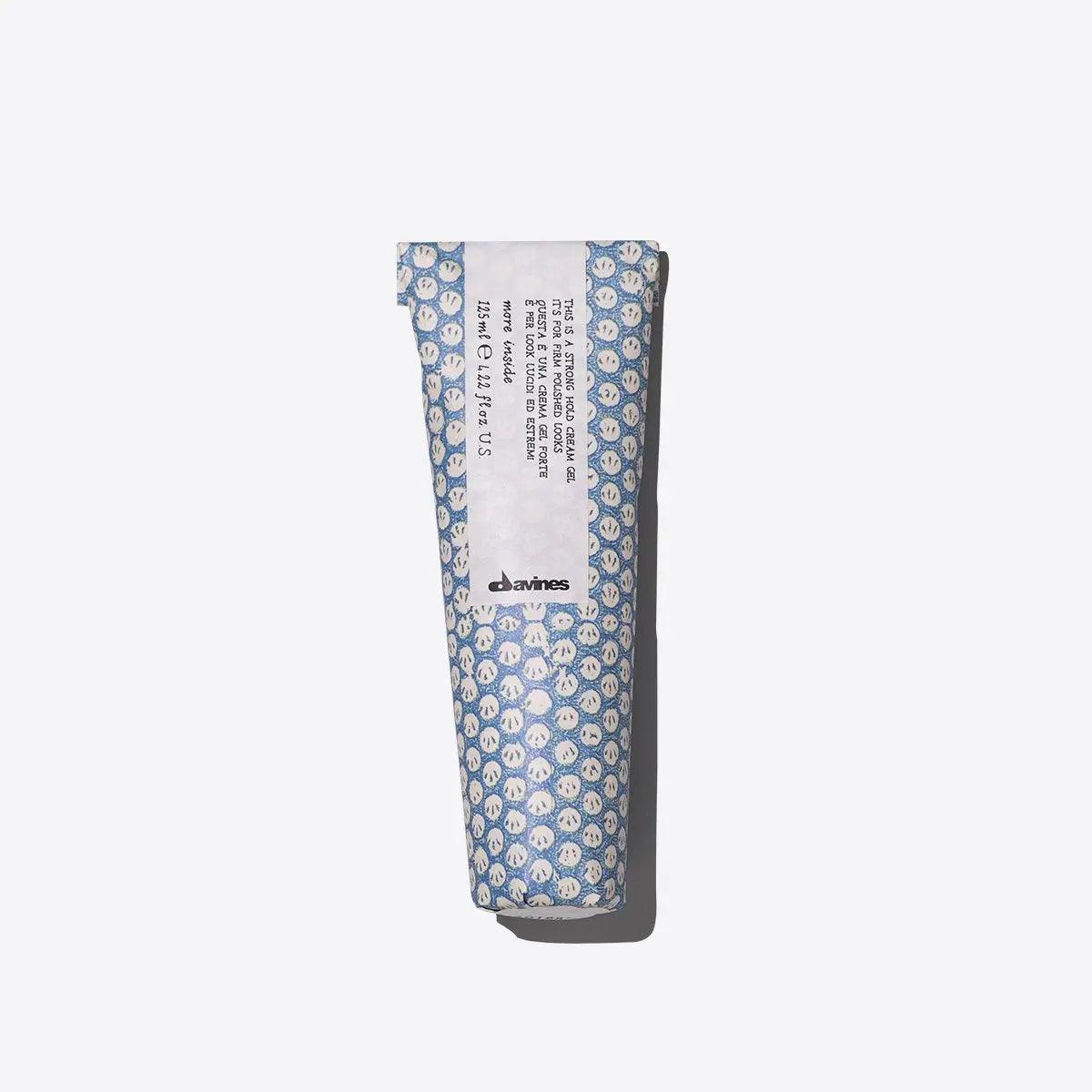 Davines hand cream in patterned blue packaging on a white background